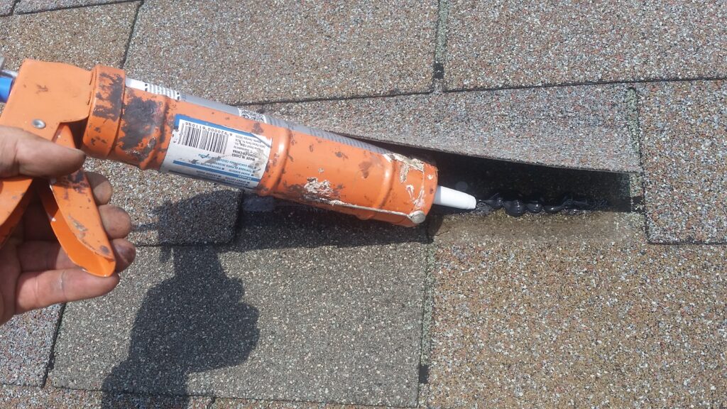 Hand sealing will help prevent the new tab and surrounding tabs from blowing off.