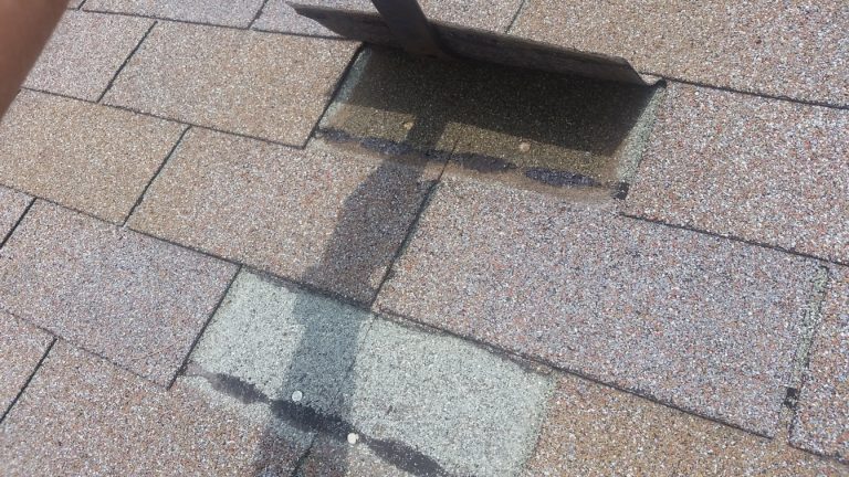 Locate the nails holding the top of the tab down, making sure not to tear any other tabs.