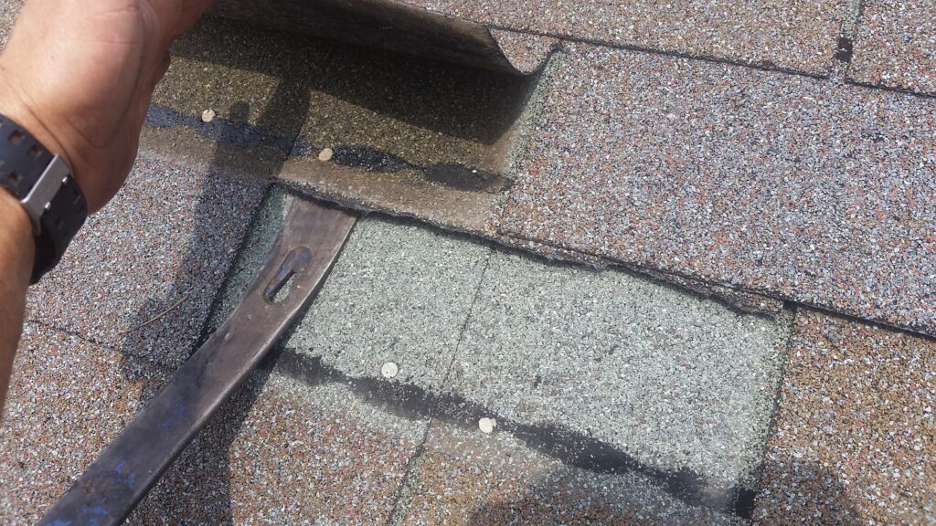 Remove the nails holding the ripped tab.