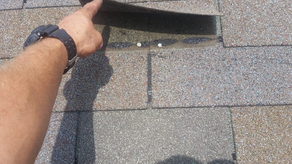 Putting nails in those spots will help keep the shingle held down.