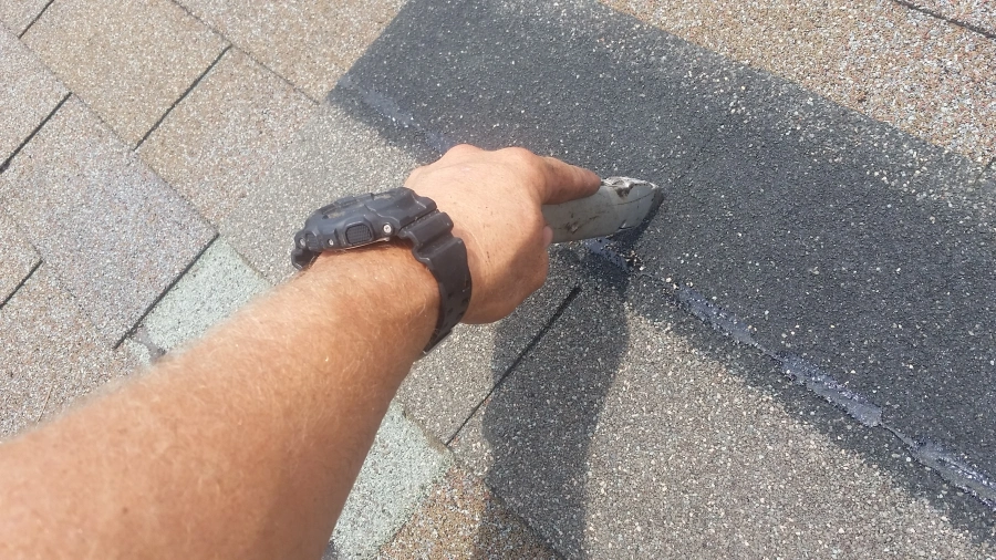 As straight as possible, cut a new tab off of a shingle.